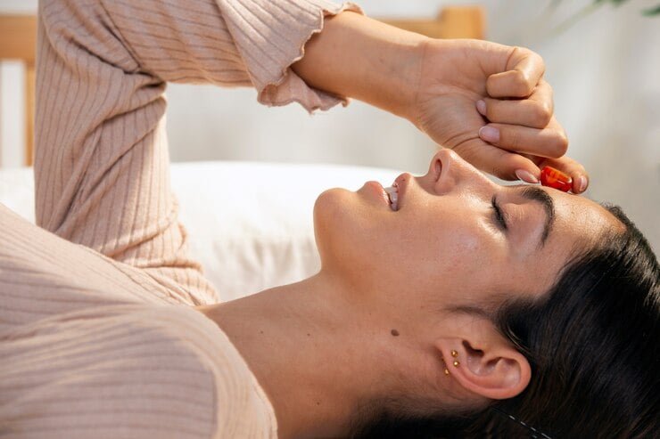 woman-laying-bed-with-crystal